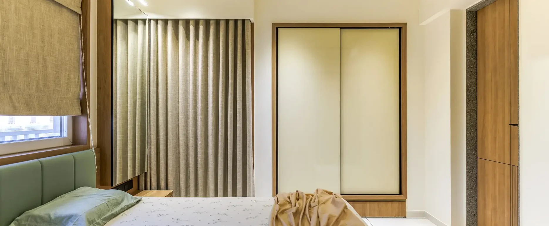 HOW TO CHOOSE AN INTERIOR DESIGNER IN RAJKOT 2 Modern Interior Design Rajkot – VRAJ Bedroom with Sliding Wardrobe